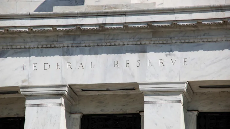 The words Federal Reserve carved into the marble facade of a central bank building